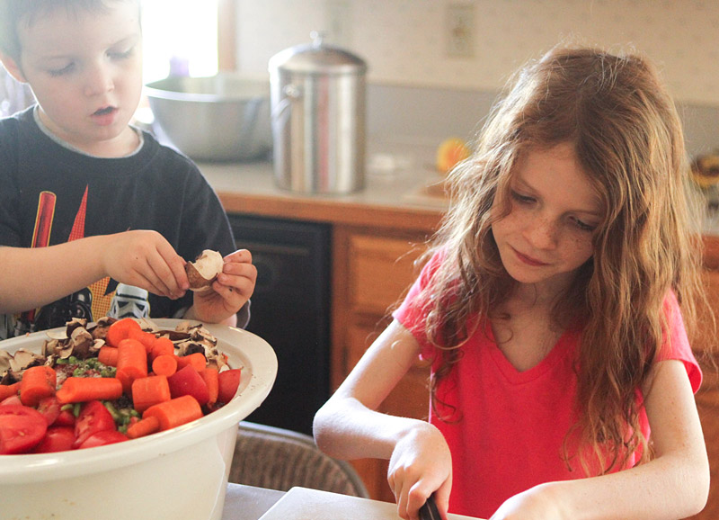 kids helping chop vegetables helps them be less picky