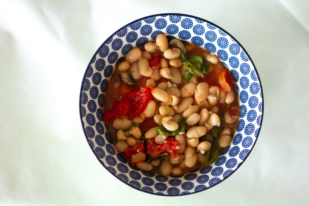 bowl of easy soup with white beans and greens