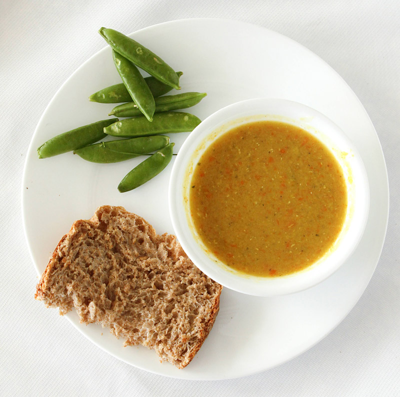 lentil soup served with bread and snap peas for picky eaters learning to like different foods